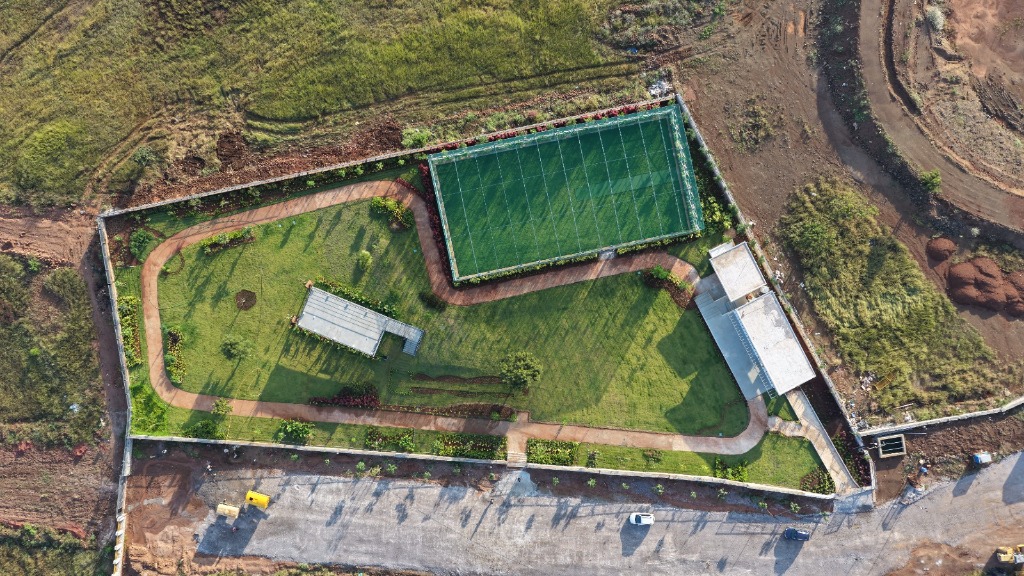 Top-down view of amenity zone and tennis court
